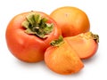 Ripe persimmon fruit and two persimmon slices on white background. File contains clipping path Royalty Free Stock Photo