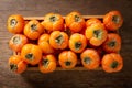 Ripe persimmon fruit in a wooden box