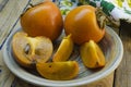 Ripe persimmon on a plate