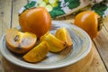 Ripe persimmon on a plate