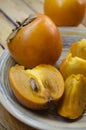 Ripe persimmon on a plate