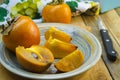 Ripe persimmon on a plate