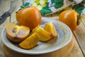 Ripe persimmon on a plate