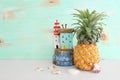 Ripe pineapple over white wooden table. Tropical summer vacation concept Royalty Free Stock Photo