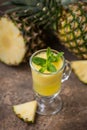 Ripe pineapples Ananas comosus and a glass Royalty Free Stock Photo