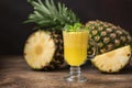 Ripe pineapples Ananas comosus and a glass Royalty Free Stock Photo