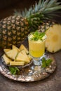 Ripe pineapples Ananas comosus and a glass Royalty Free Stock Photo