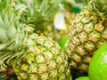 Ripe pineapples on the counter. Pineapple collection in a shop window. close-up. New Year fruit concept, freshly squeezed vitamin Royalty Free Stock Photo