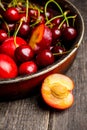 Ripe plums, nectarines and cherries in rustic pan Royalty Free Stock Photo