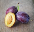 Ripe plums on old wood table Royalty Free Stock Photo