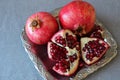 Ripe pomegranate, cut into pieces Royalty Free Stock Photo