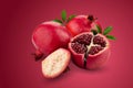 Ripe pomegranate fruit isolated on a red background Royalty Free Stock Photo