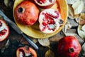 Ripe pomegranate fruit on wooden vintage background. Red juice p Royalty Free Stock Photo