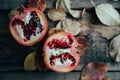 Ripe pomegranate fruit on wooden vintage background. Red juice p Royalty Free Stock Photo