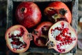 Ripe pomegranate fruit on wooden vintage background. Red juice p Royalty Free Stock Photo