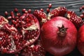 Ripe pomegranates on dark wooden background Royalty Free Stock Photo