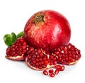 Ripe pomegranates with leaves close-up on a white background Royalty Free Stock Photo