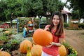 Ripe pumpkin lies with girl in a farm field Royalty Free Stock Photo