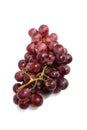 Ripe Purple Grape Bunch on Clean White Surface. Royalty Free Stock Photo