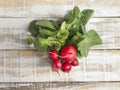 Ripe radish bunch on a wooden table Royalty Free Stock Photo