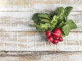 Ripe radish bunch on a wooden table Royalty Free Stock Photo