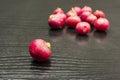 Ripe radish on the table with a group in the background.