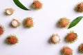 Ripe rambutan fruit pattern on white, Flat lay