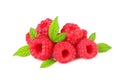 ripe raspberries with green leaves isolated on white background