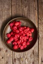 Ripe raw red raspberries in a rustic bowl Royalty Free Stock Photo