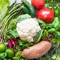 Ripe raw vegetables, fruits and herbs, background. The concept of healthy food. Royalty Free Stock Photo