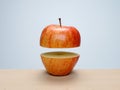 Ripe red apple cut in half with top floating above bottom Royalty Free Stock Photo