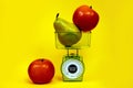 Ripe red apple pear kitchen scales fitness diet food nutrition correct yellow green Royalty Free Stock Photo