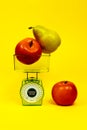 Ripe red apple pear kitchen scales fitness diet food nutrition correct yellow green Royalty Free Stock Photo