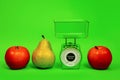 Ripe red apple pear kitchen scales fitness diet food nutrition correct yellow green Royalty Free Stock Photo