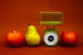 Ripe red apple pear kitchen scales fitness diet food nutrition correct yellow green Royalty Free Stock Photo