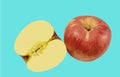Ripe red apples with half apple leaves isolated on a blue background,