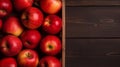 Ripe red apples in wooden box. Top view with space for your text. Generative AI Royalty Free Stock Photo