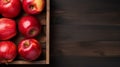 Ripe red apples in wooden box. Top view with space for your text. Generative AI Royalty Free Stock Photo