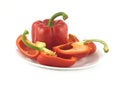 Ripe red bell peppers on a plate isolated Royalty Free Stock Photo