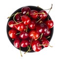 Ripe red cherries. Bowl full of sweet cherries on isolated white background. File contains clipping path Royalty Free Stock Photo
