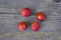 Ripe cherry plum fruits on a background of an old wooden table close-up. Royalty Free Stock Photo