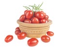 Ripe red cherry tomatoes branch in a wooden plate on a white background. Royalty Free Stock Photo