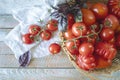 Ripe red cherry tomatoes in a wicker basket Royalty Free Stock Photo