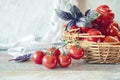 Ripe red cherry tomatoes in a wicker basket Royalty Free Stock Photo