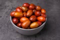 Ripe red dates in bowl on grey table, closeup Royalty Free Stock Photo
