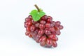 Ripe red grape. Pink bunch with leaves isolated on white Royalty Free Stock Photo