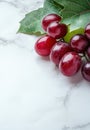Ripe red grapes on marble background Royalty Free Stock Photo