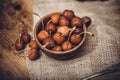 Ripe red organic cherries in a bowl and next to it on wooden table Royalty Free Stock Photo