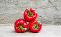 Ripe red peppers on concrete background Royalty Free Stock Photo