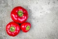 Ripe red peppers on grey background Royalty Free Stock Photo